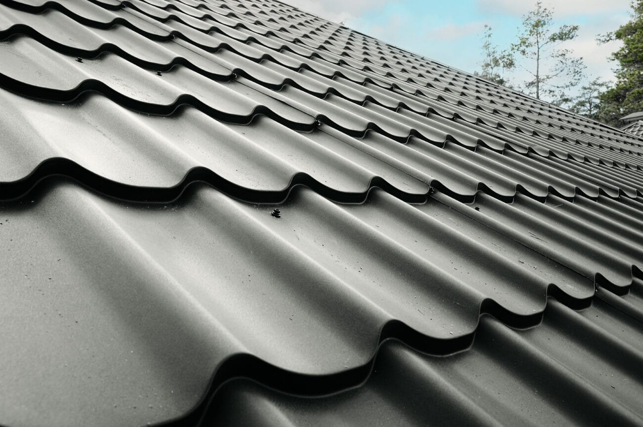 Close-up photo of a house roof with steel roofing sheet.